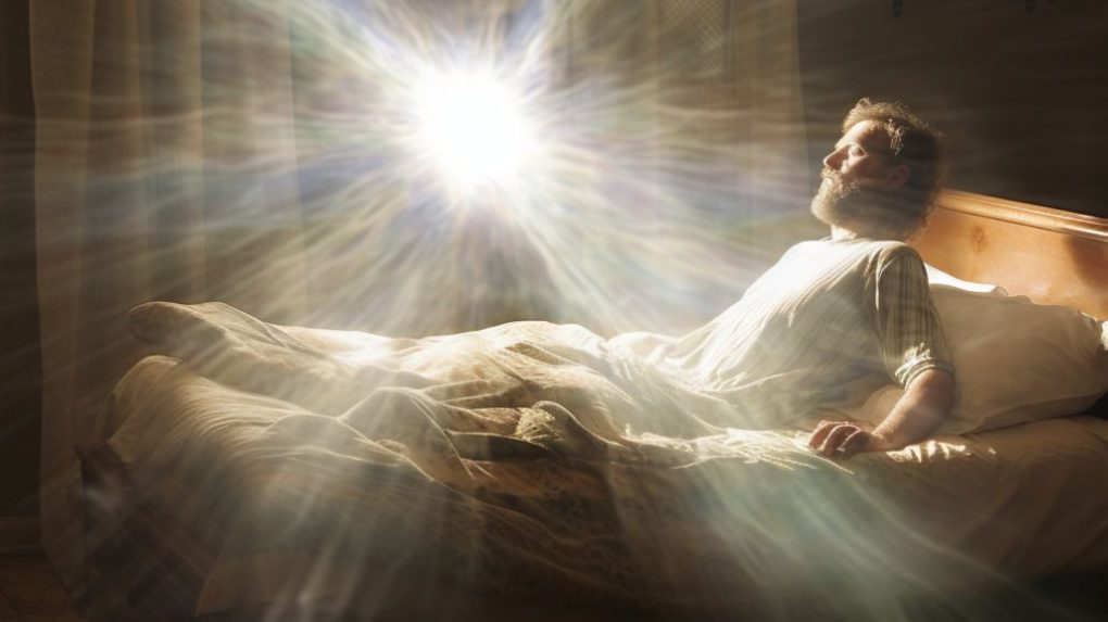 A man experiencing a near death experience with a bright white light pulling his soul from his body.